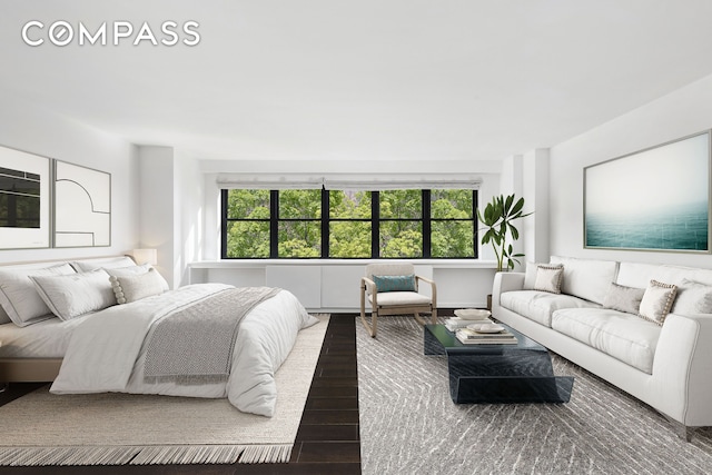 bedroom featuring multiple windows and wood finished floors