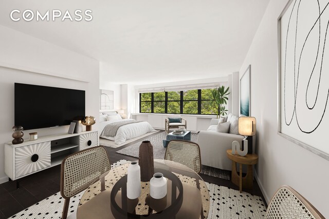 living room featuring wood finished floors and baseboards