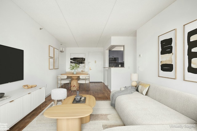 living area with dark wood-style floors