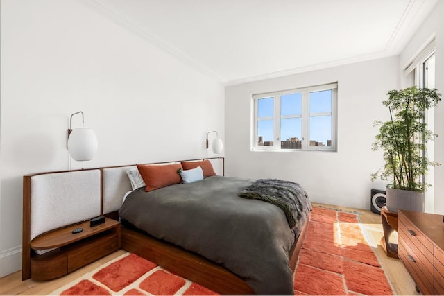 bedroom featuring multiple windows and ornamental molding