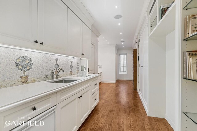 bathroom with crown molding, vanity, a tray ceiling, a bidet, and tile patterned floors