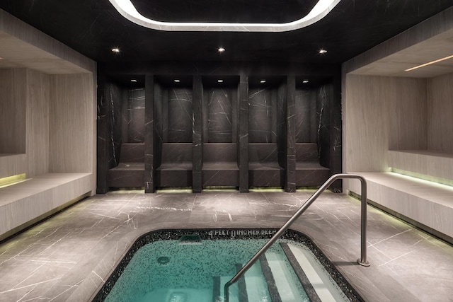 view of pool featuring an indoor hot tub