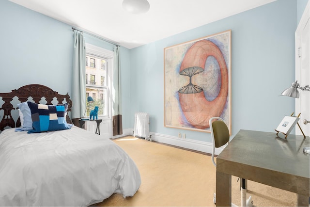 bedroom with baseboards, carpet, and radiator