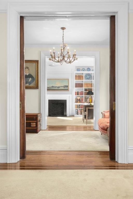 unfurnished room with a chandelier and ornamental molding