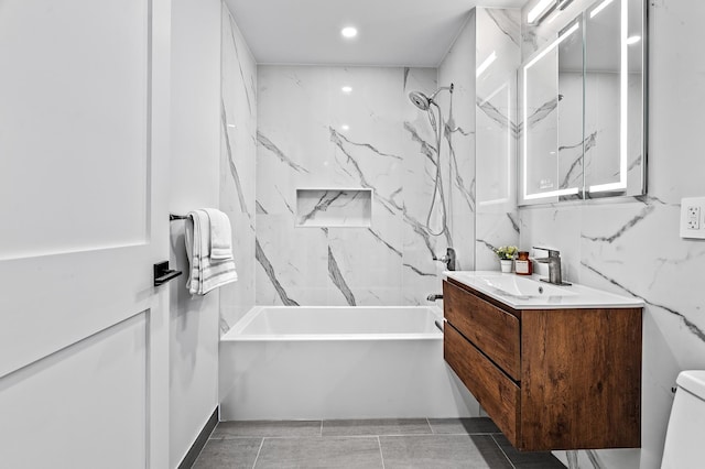 bathroom featuring vanity, toilet, and shower / bathtub combination