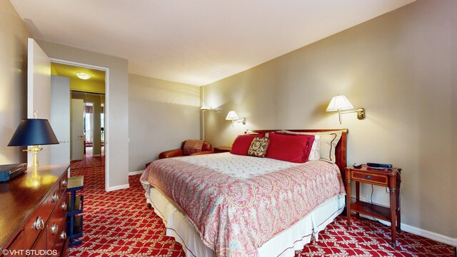 bedroom with a chandelier and dark parquet floors