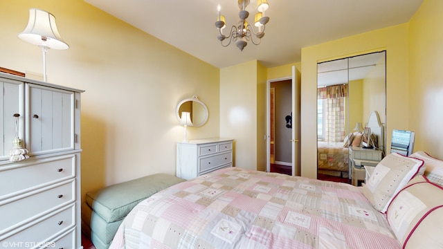 bedroom featuring a closet and an inviting chandelier