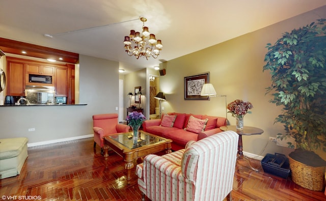 living room with a chandelier and dark parquet floors