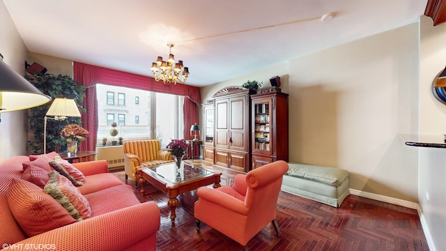 living room with an inviting chandelier and baseboards