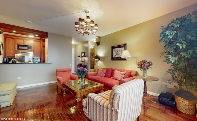 living room with a chandelier and baseboards