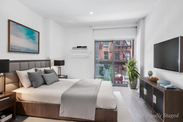 bedroom with light hardwood / wood-style flooring