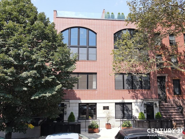 view of building exterior featuring a fenced front yard