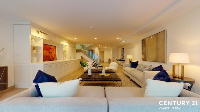 living room with light wood-style floors, recessed lighting, and stairway