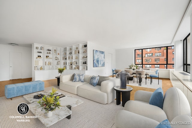 living room featuring built in shelves