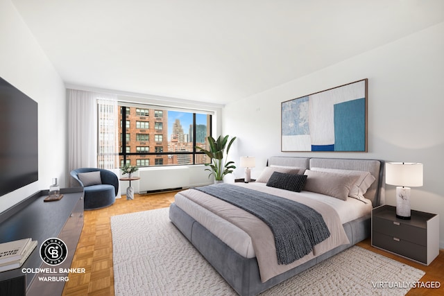 bedroom featuring light parquet flooring