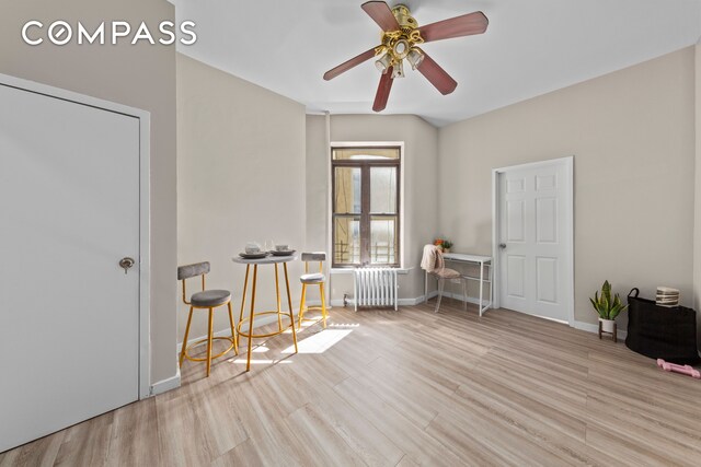 bedroom featuring ceiling fan and light hardwood / wood-style flooring