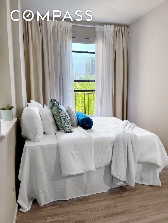 bedroom featuring wood finished floors