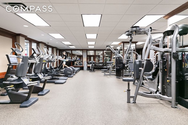 workout area featuring a drop ceiling