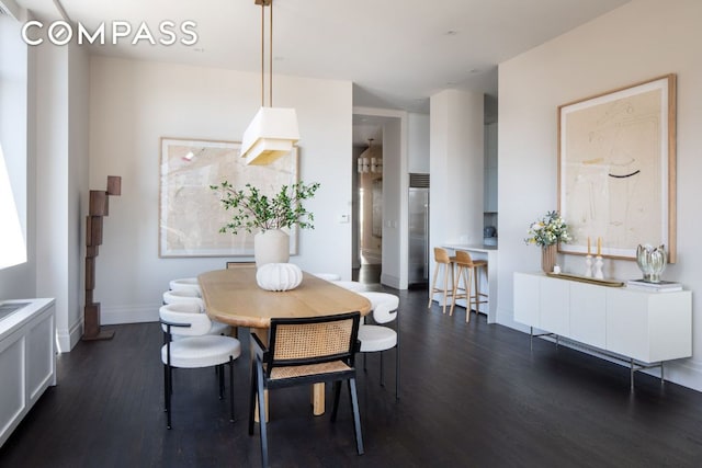 dining room featuring dark wood-type flooring