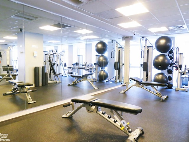 gym featuring a drop ceiling