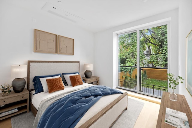 bedroom with hardwood / wood-style floors