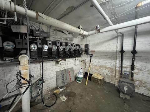 utility room featuring water heater