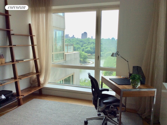 office area with light hardwood / wood-style floors