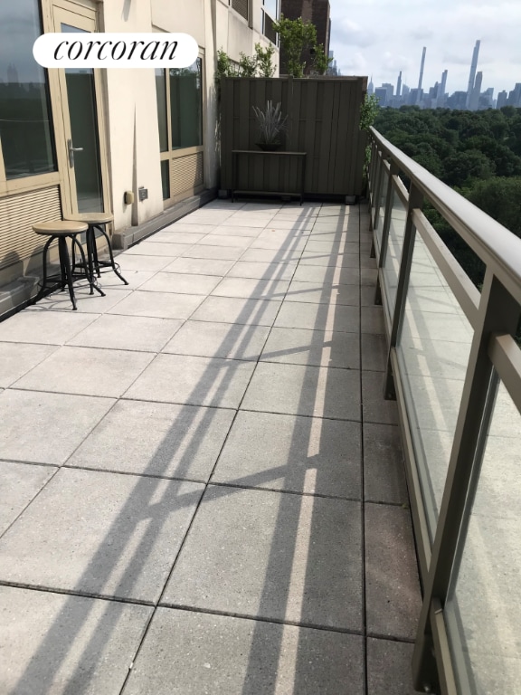 view of patio featuring a balcony