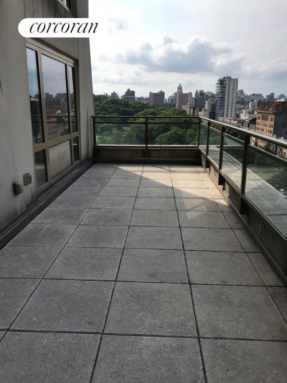 view of patio featuring a balcony