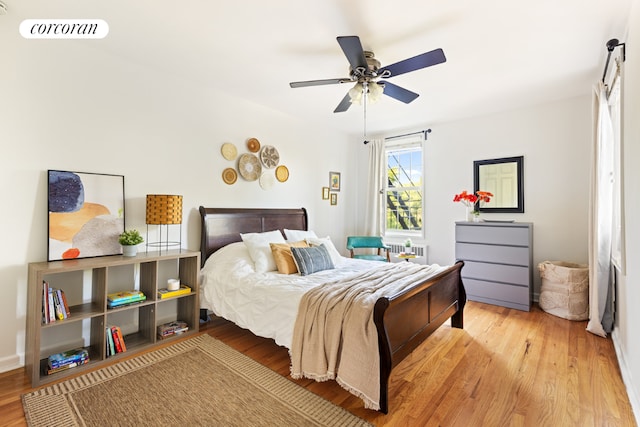 bedroom featuring ceiling fan and light wood-type flooring