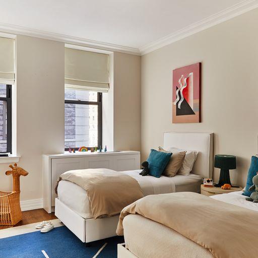 bedroom featuring crown molding and hardwood / wood-style flooring