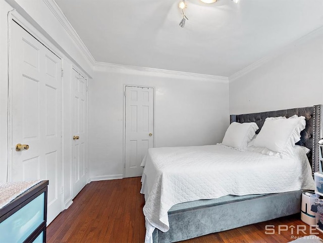 bedroom with crown molding and dark wood-type flooring