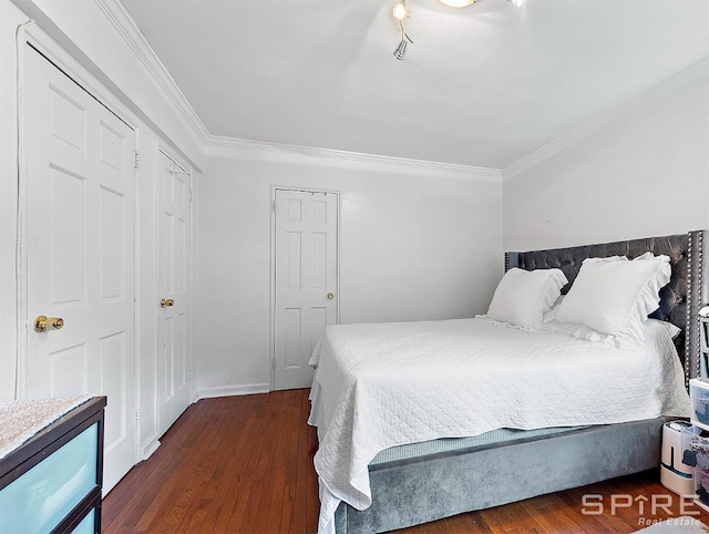 bedroom featuring ornamental molding and wood finished floors