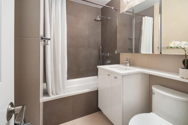 full bathroom with toilet, shower / tub combo, and vanity