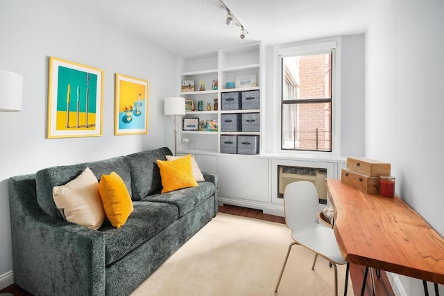 sitting room with track lighting and a wall unit AC