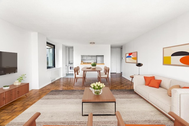 living room featuring parquet floors