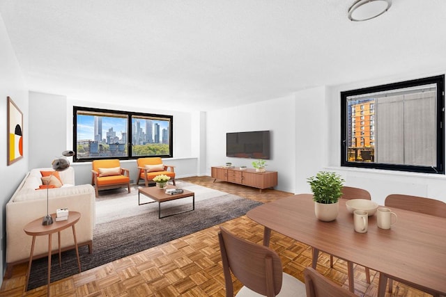 living room with parquet floors and a textured ceiling