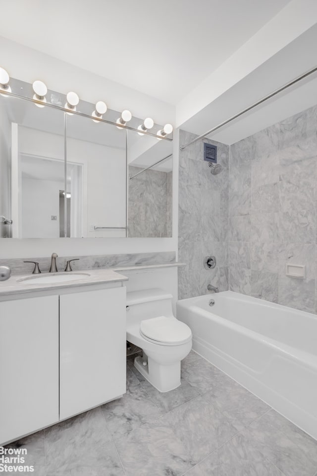 bathroom with  shower combination, marble finish floor, vanity, and toilet