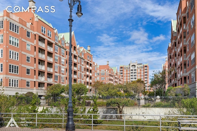 view of building exterior with fence