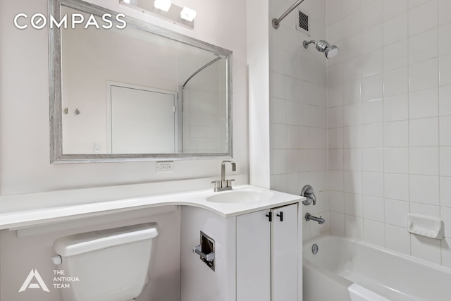 bathroom with vanity, shower / bathing tub combination, toilet, and visible vents