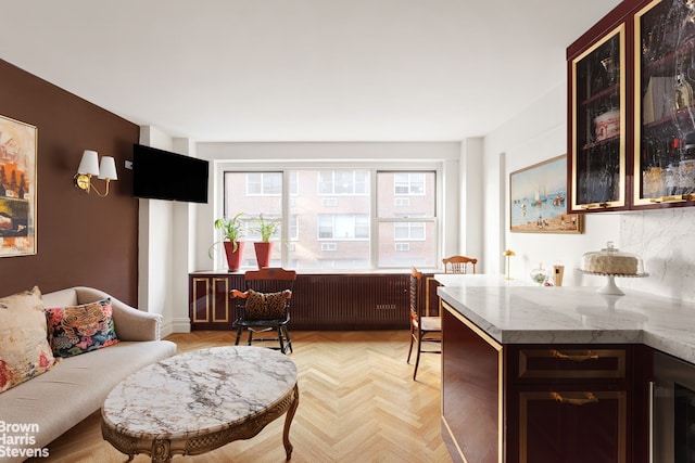 living room featuring wine cooler and light parquet floors