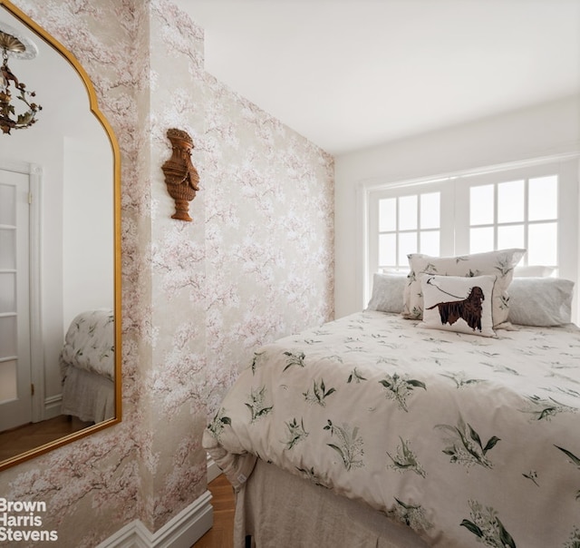 bedroom featuring wallpapered walls