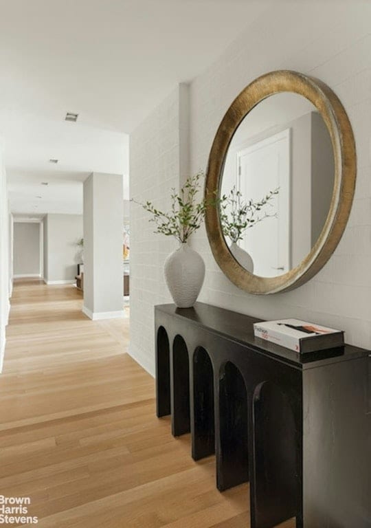 hallway with hardwood / wood-style floors