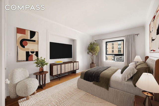 bedroom featuring wood finished floors