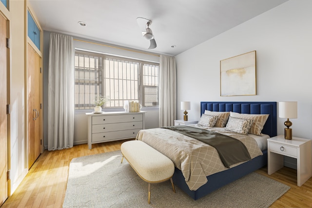 bedroom with ceiling fan and light wood-type flooring