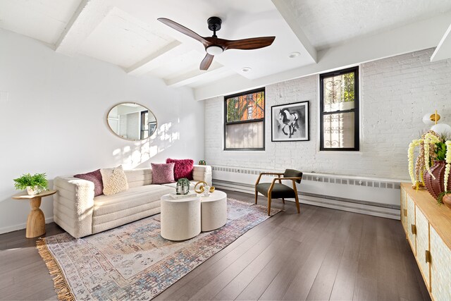 living room featuring ceiling fan, dark hardwood / wood-style flooring, and beamed ceiling