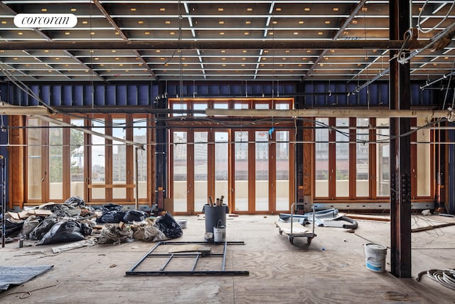 misc room featuring a towering ceiling