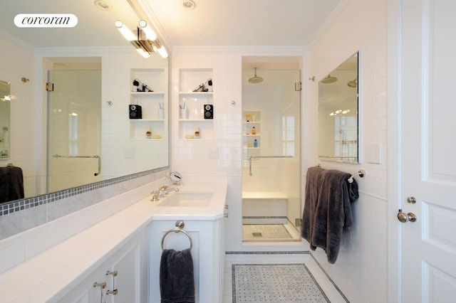 full bathroom featuring vanity, visible vents, a stall shower, crown molding, and tile patterned floors