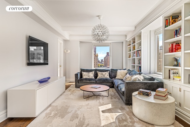 living room with visible vents, crown molding, baseboards, a chandelier, and wood finished floors