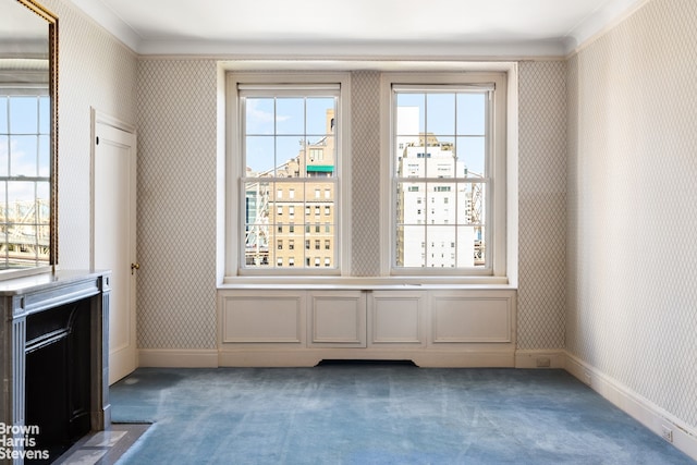 entryway featuring dark carpet, baseboards, and wallpapered walls